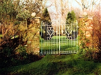 Stanstead Hall garden gates. Photograph by Rosemary Imroth of Gt. Amwell women's institute. Postcard published by Hertfordshire Federation of Women's institutes. Date unknown.
