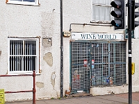 Wine World. Security is a sign of the times but the shop has a good stock and is very popular.